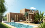 Un studio en bois avec une terrasse tropézienne au bord d'une piscine